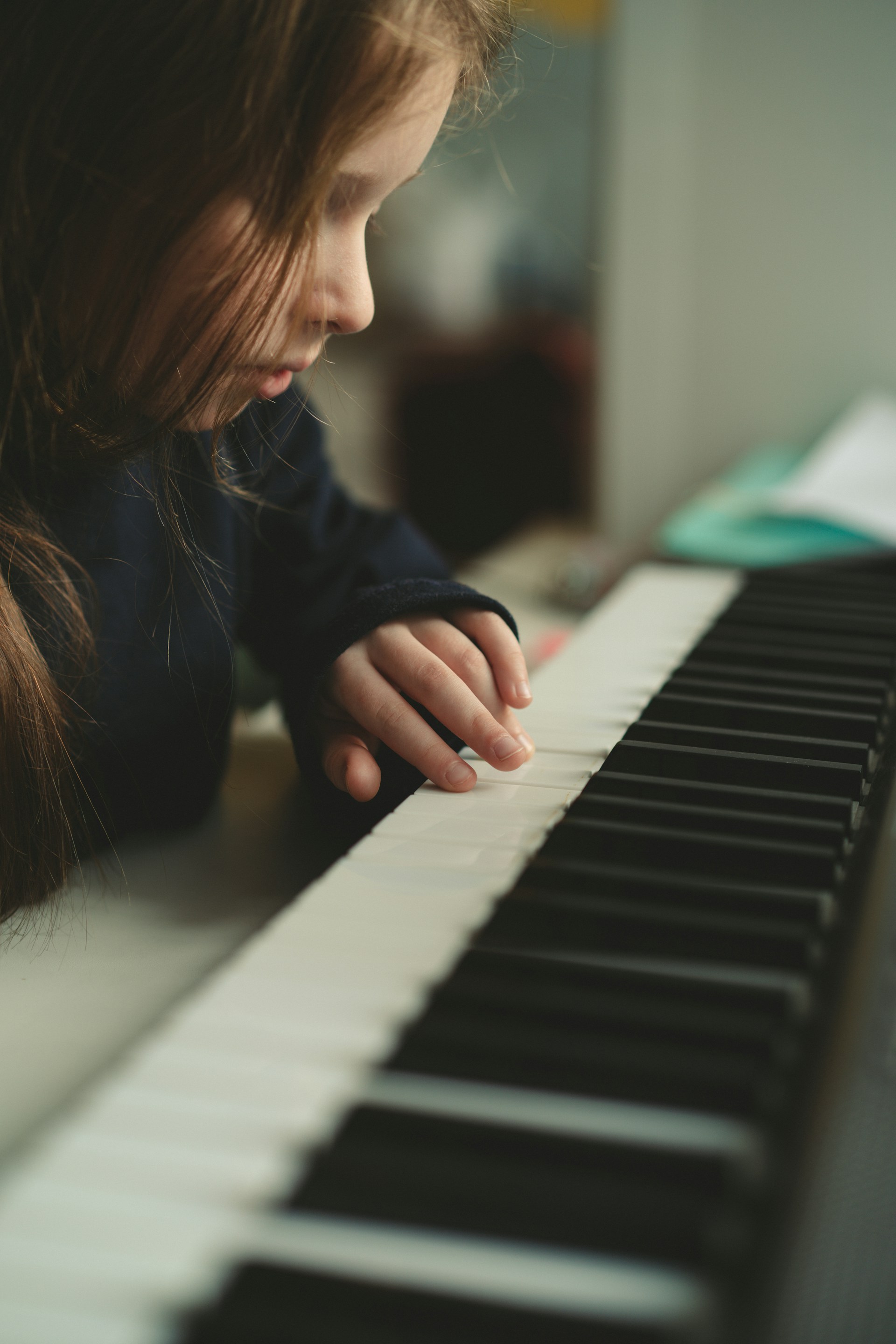 A student at the piano during a lesson